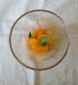 Place 4 halved kumquats, .75 oz simple syrup, and a couple fresh oregano leaves in a mixing glass